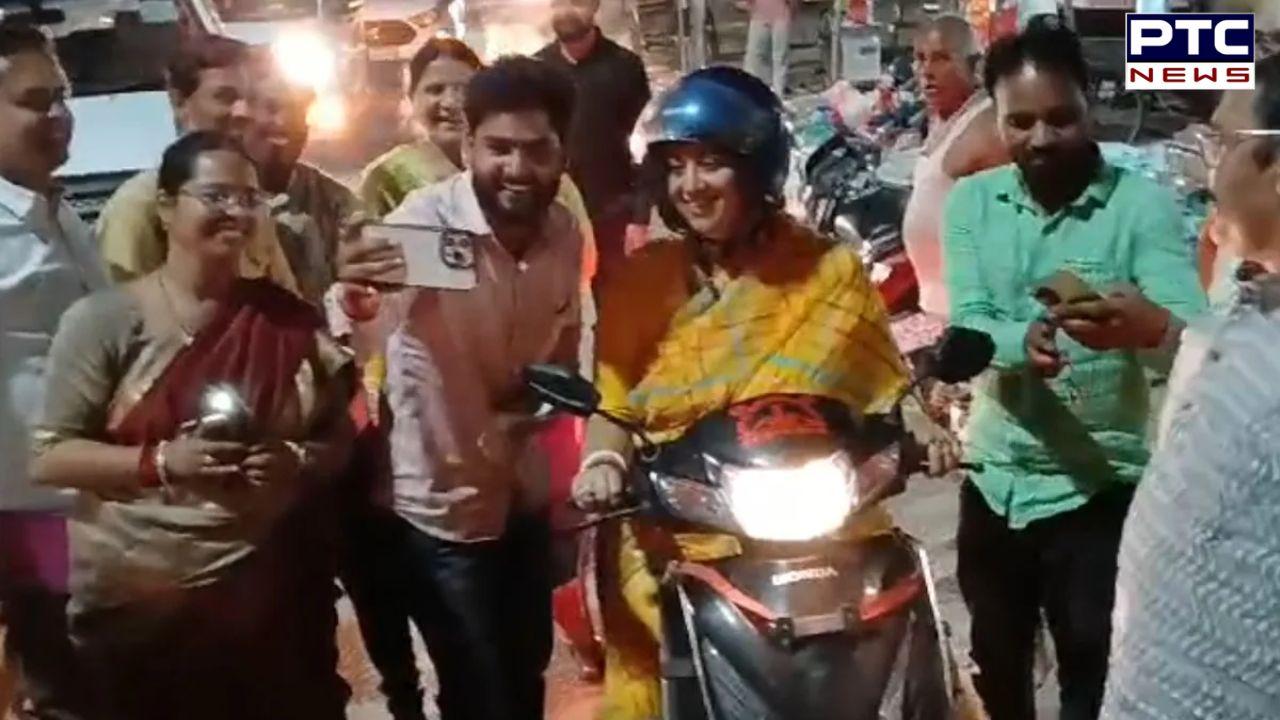 Minister Smriti Irani takes a scooter ride through Amethi