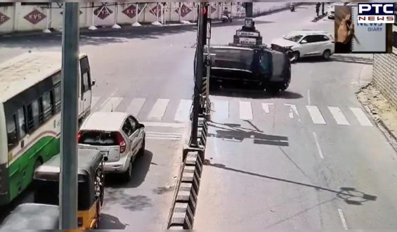 Caught on camera: Speeding car runs red light, collides with another, and flips multiple times