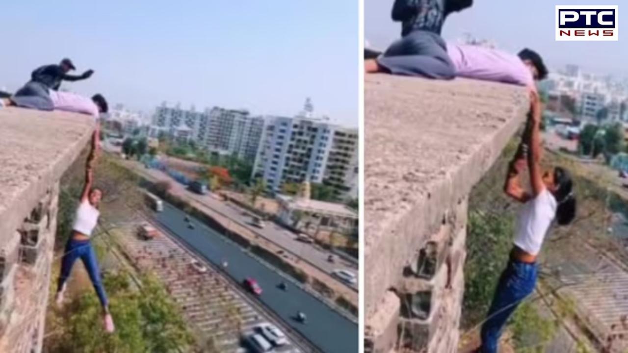 Viral video of Pune girl: Girl hangs from the top of a building stunt sparks outrage