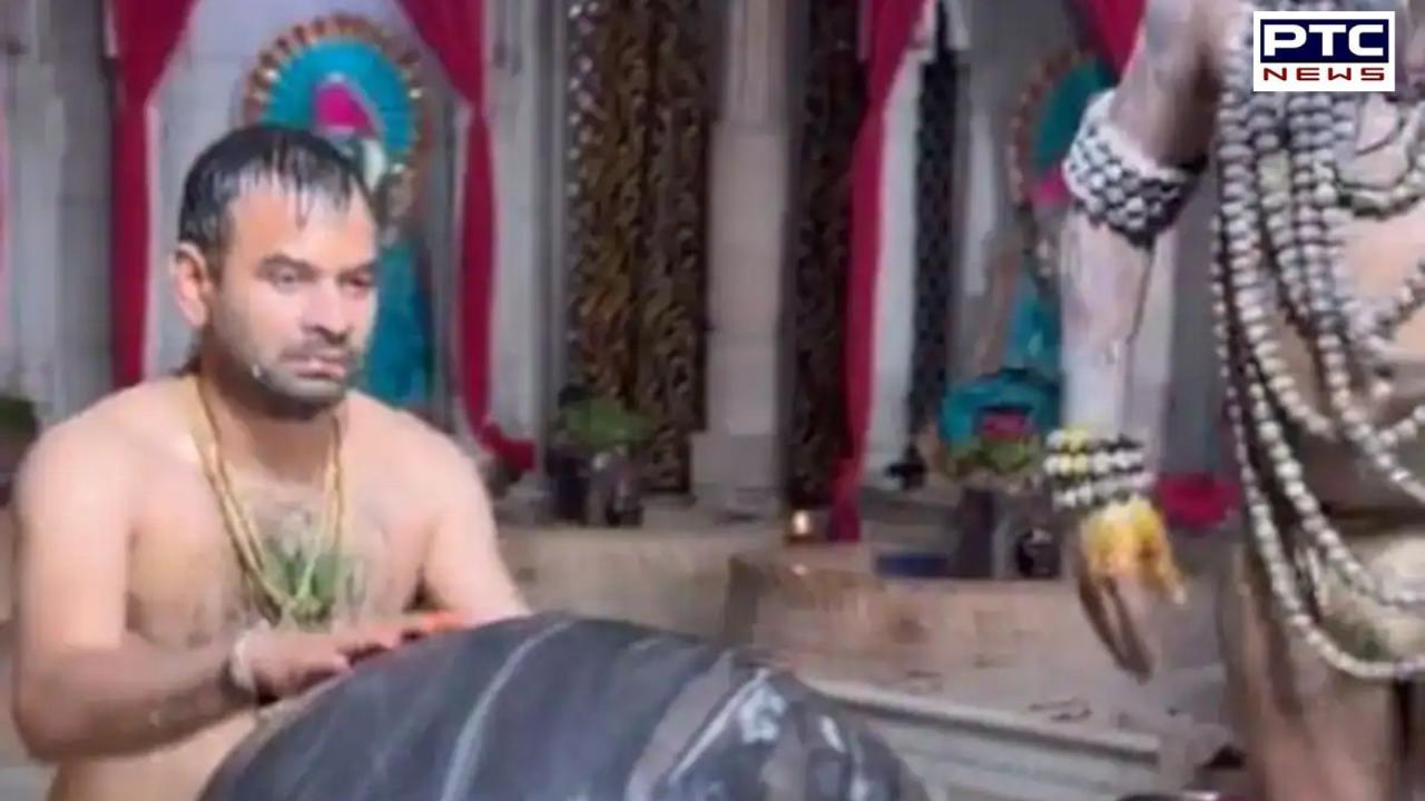 Tej Pratap Yadav embraces shivling during milk abhishekam ritual | Watch